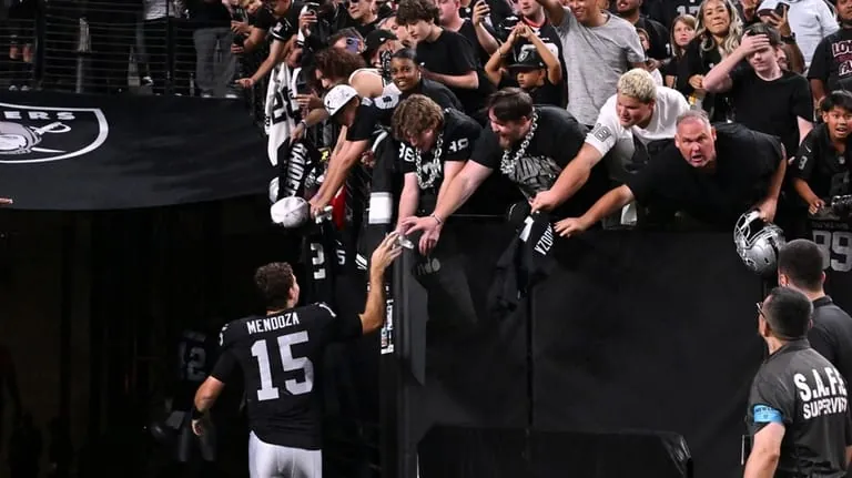 Las Vegas Raiders quarterback Fernando Mendoza (15) shakes hands with...